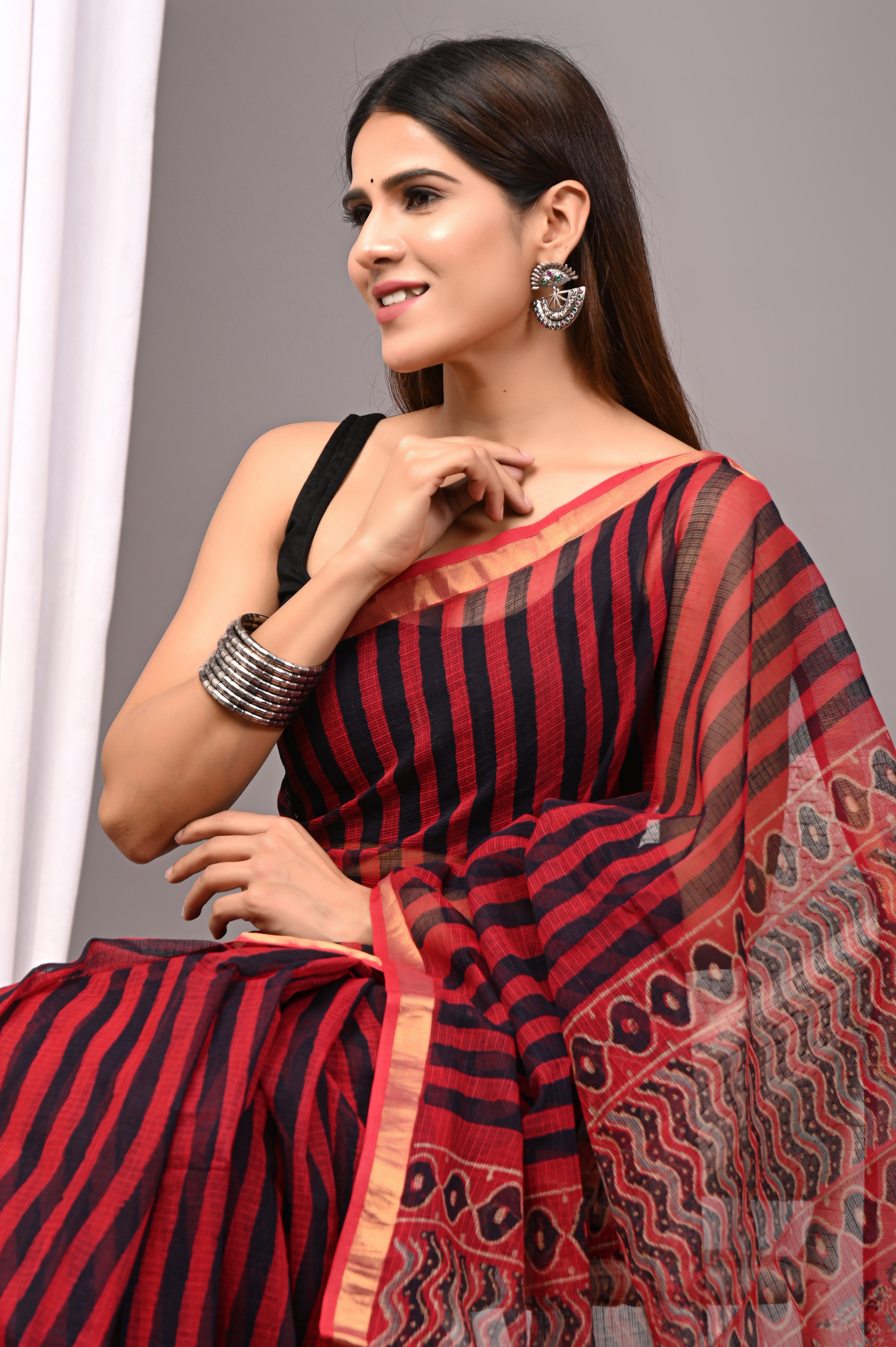 Elegant Kimaari Kota Doria saree featuring traditional hand-prints and the signature checkered weave of Jaipur.